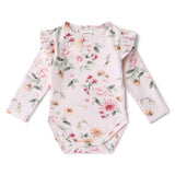 Floral-patterned baby bodysuit on a white background