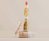 Three skincare products from the brand 'BareMinerals' on a beige background