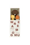 Three small plush toys in a box with 'Wreamomu' branding on a white background