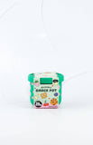 Reusable snack pot with a green lid on a white background