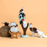 Set of small animal figurines on a beige background