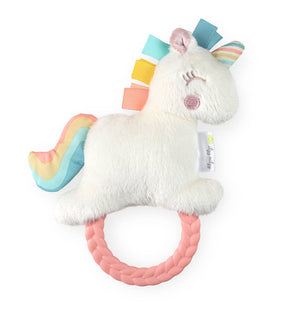 Plush toy with colorful horn and pink base on a white background