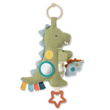 Dinosaur-shaped toy with a mirror and rattle on a white background