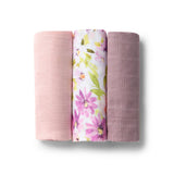Three fabric swatches in pink, floral, and purple on a white background