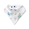 Baby bib with whale and sea plant design on a white background