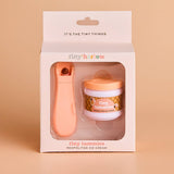 Product packaging of tiny tummies Neapolitan ice cream with a pink spoon on a beige background