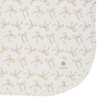 Patterned mat with bow design and Kyte Baby logo on a white background