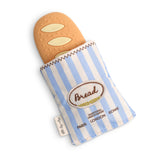 Toy bread with a striped bag on a white background