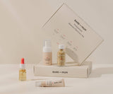 Bare-Mum skincare discovery set with products and packaging on a neutral background