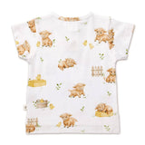 A white short-sleeve baby t-shirt featuring a cute watercolor print of sheep, chicks, bunnies, and farm accessories.