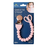 Pink silicone pacifier clip with packaging on a white background