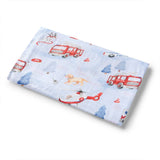 Flannel fabric with fire truck and dog pattern on a white background
