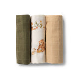 Three folded fabric swatches in green, white, and beige with bear designs on a white background