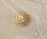 Small pile of sand on a textured beige surface
