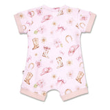 A baby short-sleeve romper in light pink with a western-themed print featuring cowboy boots, hats, bows, flowers, and horseshoes, finished with solid pink ribbed cuffs and leg openings.