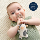 Baby holding a plush cow toy and a pacifier with text 'Includes natural rubber paci'.