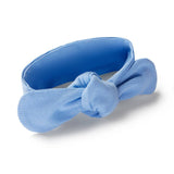 Blue headband with a bow on a white background