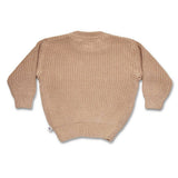 Beige knitted sweater on a white background