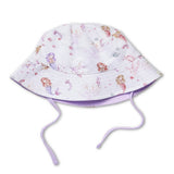 A white bucket hat with a mermaid pattern in pastel pink, purple, and blue, featuring adjustable drawstrings.