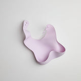 Purple bib on a light gray background