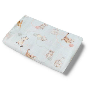 Flannel crib sheet with cat pattern on a light blue background