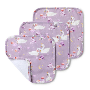 Set of three baby bibs with swan design on a purple background
