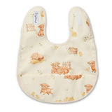 A cream-colored baby bib with a watercolor print of farm animals including cows, sheep, chicks, and a duck, shown on a plain white background.