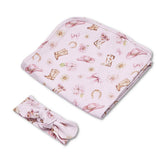 A light pink baby blanket and matching headband set with a western-themed print featuring cowboy boots, hats, bows, flowers, and horseshoes, displayed on a clean white background.