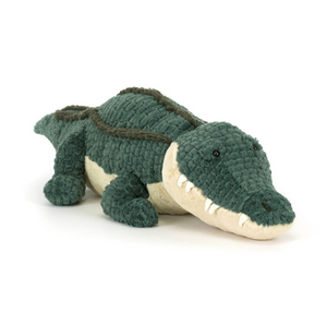 Plush toy alligator on a white background