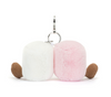 Plush keychain with white and pink sections and brown paws on a white background
