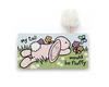 Children's book with a bunny illustration and text on a white background