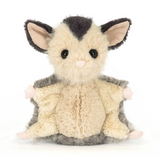 Stuffed toy possum on a white background