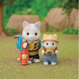 Two toy figures of animals in outdoor clothing with a lantern and fishing rod, set against a natural background.