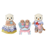 Set of toy figures including a mother figure, twins in a stroller, and a father figure on a white background
