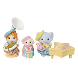 Three animated character figurines with a piano on a white background