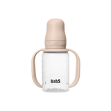 BIBS baby bottle with beige lid and handles on a white background