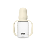 BIBS baby bottle with beige lid and handles on a white background