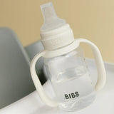 BIBS baby bottle with handle on a neutral background