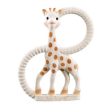 Giraffe-shaped teething ring with brown spots on a white background